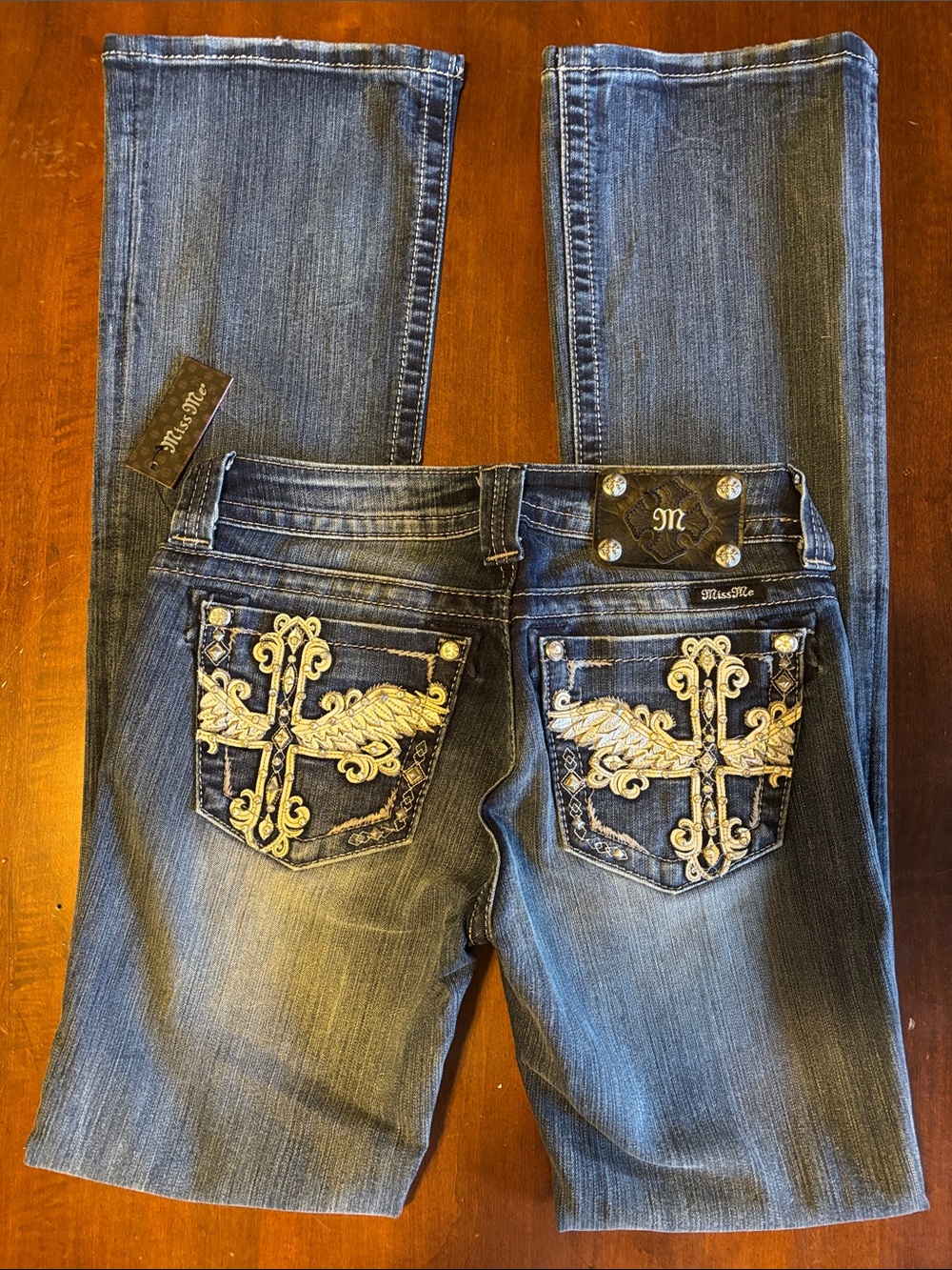 MISS ME - NWT JP6187B Slightly Distressed 27 Winged Cross Bootcut Jeans (L-125)